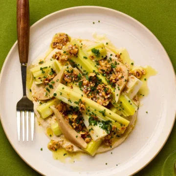 Jackson Boxer’s vegan recipe for poached leeks with pickled pear and hazelnuts